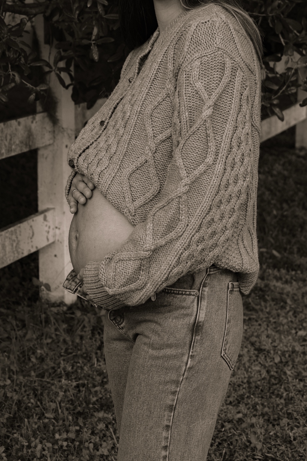 Close-up maternity portrait in a knit sweater